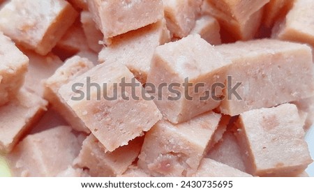 A pile of diced raw pork meat. Pork that has been canned and processed. Royalty-Free Stock Photo #2430735695