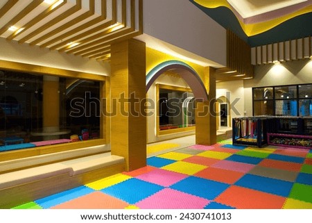 Playroom for young children, bright colored furniture.