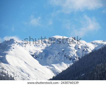 snowy mountains - hello winter - austrian alps  Royalty-Free Stock Photo #2430760139