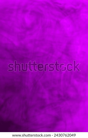 water soluble violet photo There are patterns created by the flow of paint in the water.