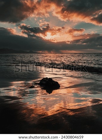sunsets of las canteras beach Royalty-Free Stock Photo #2430804659