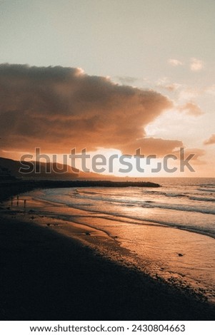 sunsets of las canteras beach Royalty-Free Stock Photo #2430804663