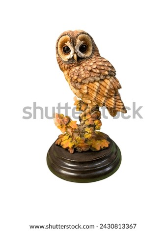 Beautiful owl sculpture on white isolated background