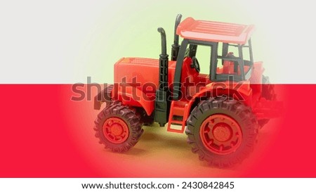 Farmers' protests in Poland. Red toy tractor on green background, selective focus, agriculture concept.