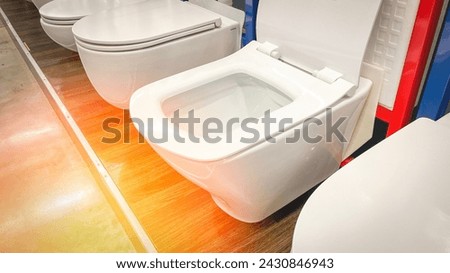 Close-up toilet bowl in plumbing store, Selective Focus, New Sanitary Ware for Washroom.