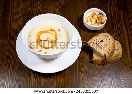 Vegetable soup in white porcelain bowl
