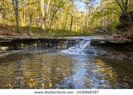 Autumn Waterfall in Woodland Serenity, Hathaway Preserve - Eye-Level View Royalty-Free Stock Photo #2430868187