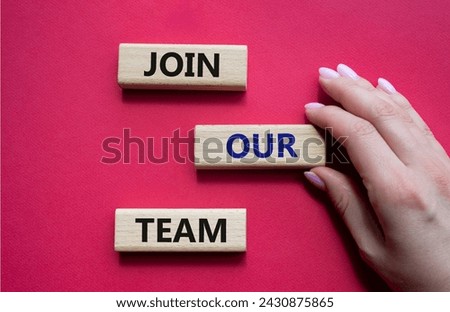Join our team symbol. Wooden blocks with words Join our team. Beautiful red background. Businessman hand. Business and Join our team concept. Copy space.