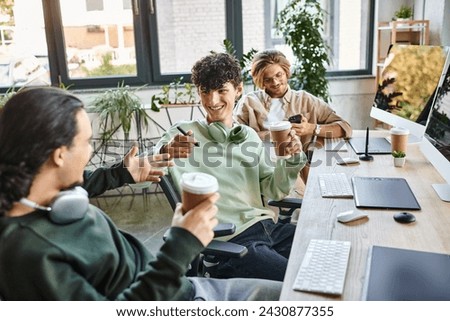 Young professionals smiling together during coffee break at a startup office, post production team