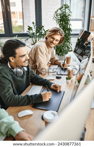 young post production team smiling and editing photos in modern office space, cheerful men in 20s