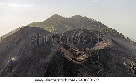 aerial drone view of several volcano craters in a row on La Palma