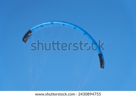 A parachute - a wing with slings against the blue sky. Copy space.                               