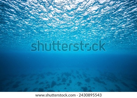 A rainy ocean surface picture taken underwater