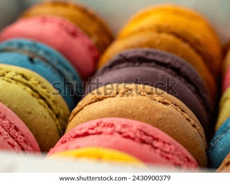 Packaging of Colorful French Macaroons. French macaroons close-up. Royalty-Free Stock Photo #2430900379