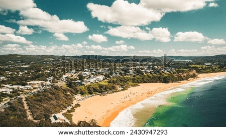 Stunning ocean view of the waves and beach in the Northern Beaches of NSW, Sydney, Australia. The view was captured from above using a drone. Royalty-Free Stock Photo #2430947293