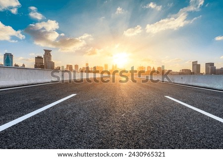 Asphalt highway road and city skyline with modern buildings scenery at sunset in Shanghai