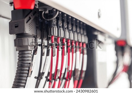 DC cable connects electricity from the solar panel to the inverter. Royalty-Free Stock Photo #2430982601