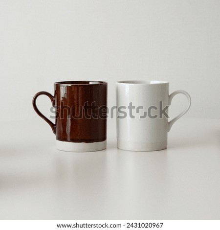 ivory and brown ceramic mugs