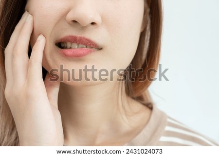 Asian woman feel toothache from gingivitis, female suffer tooth, decay problems, dental care. sensitive tooth, decay problem, bad breath, Gingival Recession, Oral Hygiene instruction, tooth extraction Royalty-Free Stock Photo #2431024073