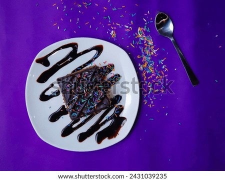 Chocolate Brownie decorated on a Purple Background