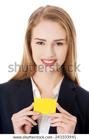 Beautiful smiling businesswoman with business card.