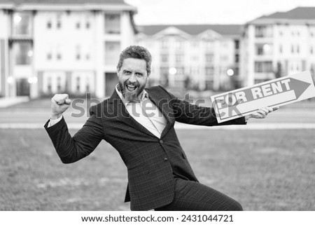 rent property by renter adviser man show success. renter adviser man hold board for rent sign.