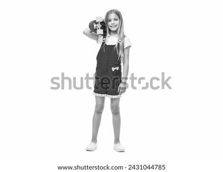 full length of teen girl with skateboard on background. photo of teen girl with skateboard.