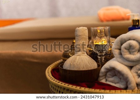 Thai Spa massage compress balls, herbal ball and treatment spa, relax and healthy care with flower, Thailand. Healthy Concept. Royalty-Free Stock Photo #2431047913