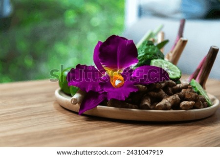 Thai Spa massage compress balls, herbal ball and treatment spa, relax and healthy care with flower, Thailand. Healthy Concept. Royalty-Free Stock Photo #2431047919