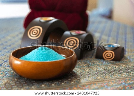 Thai Spa massage compress balls, herbal ball and treatment spa, relax and healthy care with flower, Thailand. Healthy Concept. Royalty-Free Stock Photo #2431047925