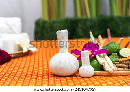 Thai Spa massage compress balls, herbal ball and treatment spa, relax and healthy care with flower, Thailand. Healthy Concept. Royalty-Free Stock Photo #2431047929