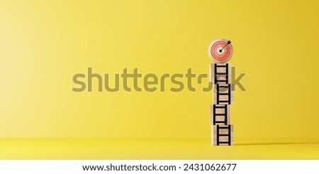 Dartboard with arrow on the top of ladders step for target and goal concept.