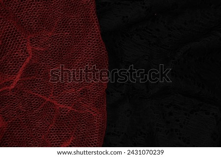 abstract background of red mesh on black background with negative space