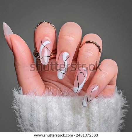Pink and white or black  color simple Nail art design in young women's hand Royalty-Free Stock Photo #2431072583