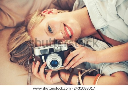 Portrait, woman and lens for retro, fashion and casual outfit for weekend getaway in Canada. Smile, camera and female person in stylish, trendy and clothing for analog, travel and photography