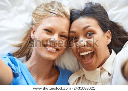 Women, selfie and smiles by friends on bed for profile picture, app and social media network for fun. Diverse, young and excited together in room for crazy and silly memories to bond for friendship