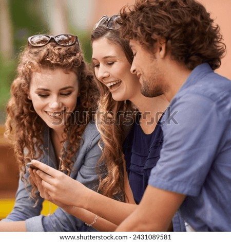 Friends, laughing and talking with cellphone for social media, internet and text. Young people, conversation and humor with tech for online and scrolling for memes, comedy and laughter with app Royalty-Free Stock Photo #2431089581