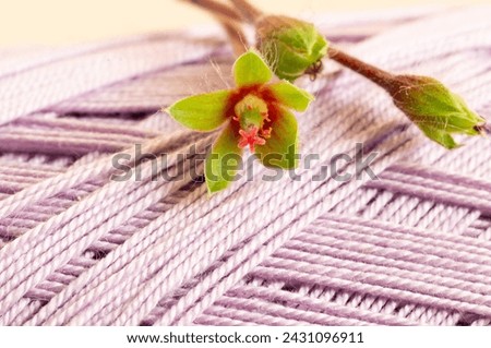 Stretched threads, publication background, green flower