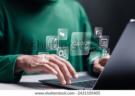 Startup business concept. Strategic planning and business success. Person use laptop with startup new business icon on virtual screen.