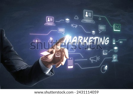 Businessman touching virtual MARKETING text surrounded by digital icons. Digital marketing concept