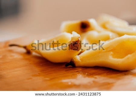 delicious peeled pears close-up on wooden board stock photo