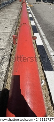 a red pipe sitting on the side of a road, steel pipes, pbr material, single long stick, dynamic shading.