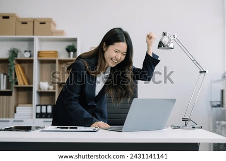 business woman are excited business success with inspiration from their excellent financial results that are happy working in a modern office on a computer.