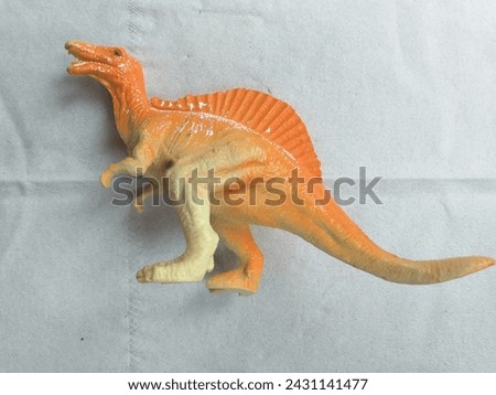 Dinosaur toys on a white paper background in Kalibagor, February 28, 2024