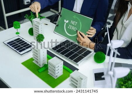 Businessman team brainstorming using tablet, laptop computer for working technology and business,  Renewable energy-based green businesses and global warming. Reduce CO2 emission.