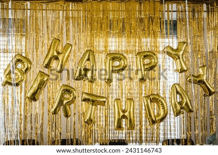Birthday party. Happy birthday, text. Arch decorated with golden balloons. Photo-wall decoration with gold background. Trendy autumn decor. Celebration concept. Royalty-Free Stock Photo #2431146743