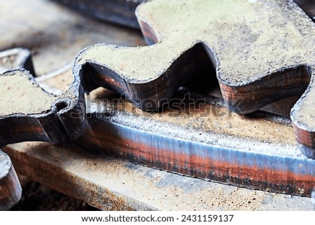 rusty metal and metal products with teeth cut with a plasma cutter. abstract backgrund