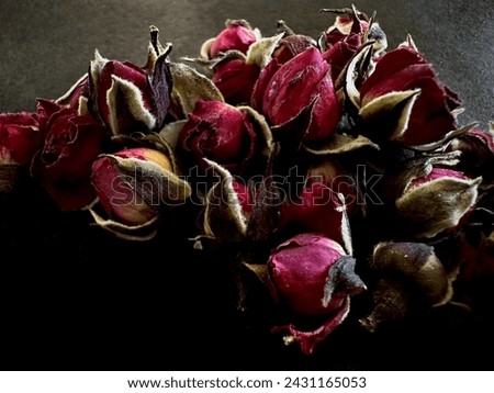 dry tea roses, gothic dark romantic background. Luxury fragrance.