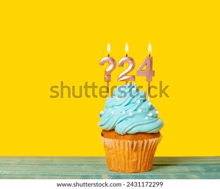 Birthday Cake With Candle Question Mark And Number 24 - On Yellow Background.