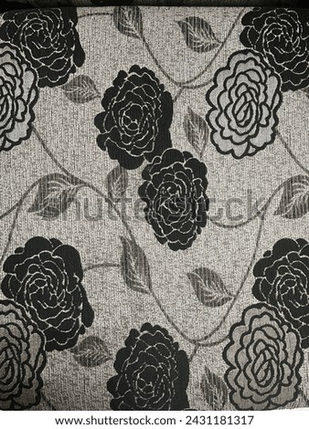 Transform your living space with this elegant floral-themed photo featuring striking grey and black flowers intertwined with delicate grey leaves. Enhance your interior decor with the subtle beauty of